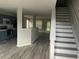 Open living area featuring kitchen, staircase, and new flooring at 737 Outlook Way, Atlanta, GA 30349