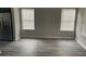 Living room with new flooring, trim, and lots of light at 737 Outlook Way, Atlanta, GA 30349