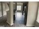 Hallway view of kitchen and living room with stainless steel appliances at 737 Outlook Way, Atlanta, GA 30349