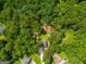 Aerial view of the property surrounded by lush green trees at 169 Knights Ct, Dallas, GA 30157