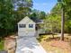 Charming house with a two-car garage, blue shutters, and a well-manicured front yard at 169 Knights Ct, Dallas, GA 30157