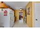 Bright yellow kitchen with lots of counter space and access to the dining area at 169 Knights Ct, Dallas, GA 30157