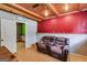 Cozy living room with wood-beamed ceilings, hardwood floors and a comfortable love seat, perfect for relaxation at 169 Knights Ct, Dallas, GA 30157