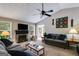 Comfortable living room with vaulted ceilings, large windows, and a beautiful stone fireplace at 169 Knights Ct, Dallas, GA 30157