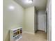 Small room with light green walls, beige linoleum flooring, and a white shelving unit at 169 Knights Ct, Dallas, GA 30157