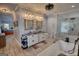 Open bathroom with a dual sink vanity, a large walk-in shower, and a luxurious soaking tub at 540 Benton Rd, Covington, GA 30014