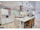 Bright open kitchen with white cabinetry, quartz countertops and stainless appliances at 540 Benton Rd, Covington, GA 30014