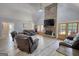 Open-concept living room with stone fireplace, hardwood floors, and a neutral color palette at 540 Benton Rd, Covington, GA 30014