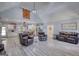 Open-concept living room and kitchen featuring modern finishes and wood-look flooring at 540 Benton Rd, Covington, GA 30014