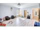 Large playroom featuring wood-look floors and plenty of space for toys and activities at 540 Benton Rd, Covington, GA 30014