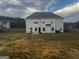 Large backyard with a brick paver path and a fenced perimeter at 64 N Village Cir, Rydal, GA 30171