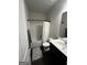 Well-lit bathroom featuring a combination tub and shower, modern vanity, and stylish fixtures at 64 N Village Cir, Rydal, GA 30171