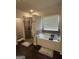 Bright bathroom boasts a luxurious soaking tub, separate shower, and modern fixtures at 64 N Village Cir, Rydal, GA 30171