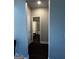 Hallway view of bathroom showcasing a bathtub with a shower curtain at 64 N Village Cir, Rydal, GA 30171