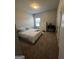 Bedroom featuring neutral walls, carpet floors, and ample space, with a window providing natural light at 64 N Village Cir, Rydal, GA 30171