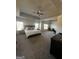 Spacious main bedroom with a ceiling fan and ample natural light, ideal for relaxing at 64 N Village Cir, Rydal, GA 30171