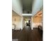 Inviting foyer showcases soaring ceilings and elegant dark wood flooring at 64 N Village Cir, Rydal, GA 30171