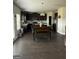Open-concept kitchen featuring dark cabinetry, island and modern appliances at 64 N Village Cir, Rydal, GA 30171