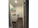 Convenient laundry room with washer, dryer, and storage shelves at 64 N Village Cir, Rydal, GA 30171