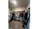 Spacious walk-in closet featuring ample storage and organization for clothes and accessories at 64 N Village Cir, Rydal, GA 30171