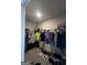Functional walk-in closet with ample storage space, providing organization for clothing and accessories at 64 N Village Cir, Rydal, GA 30171