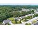 Aerial view of a residential neighborhood, showcasing well-maintained homes, manicured lawns, and tree-lined streets at 3953 Willow Fields Ct, Loganville, GA 30052