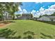 Large grassy backyard, surrounded by a wooden fence, perfect for pets, games, or creating your private oasis at 3953 Willow Fields Ct, Loganville, GA 30052