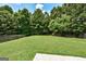 Large, well-maintained backyard featuring a lush green lawn at 3953 Willow Fields Ct, Loganville, GA 30052