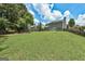 Spacious green backyard featuring a lawn with ample space, enclosed with a wooden fence for privacy and relaxation at 3953 Willow Fields Ct, Loganville, GA 30052