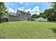 Expansive backyard with lush green lawn, ideal for outdoor activities and entertaining with a two-story home at 3953 Willow Fields Ct, Loganville, GA 30052