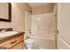 Bathroom featuring a tub and shower, toilet, and vanity with a solid surface countertop at 3953 Willow Fields Ct, Loganville, GA 30052