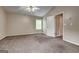 Spacious bedroom features a large window, neutral walls, and plush carpet at 3953 Willow Fields Ct, Loganville, GA 30052