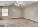 Large bedroom with neutral walls and carpet, plus a ceiling fan at 3953 Willow Fields Ct, Loganville, GA 30052