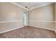 Dining room featuring tan carpet, a chandelier, and neutral wall color at 3953 Willow Fields Ct, Loganville, GA 30052