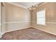 Dining room featuring a chandelier, wainscoting, and a window with blinds at 3953 Willow Fields Ct, Loganville, GA 30052