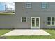 Exterior rear view features gray siding and a patio at 3953 Willow Fields Ct, Loganville, GA 30052