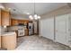 Spacious kitchen featuring stainless steel appliances, tile floors, and wooden cabinetry at 3953 Willow Fields Ct, Loganville, GA 30052