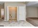 Bright laundry room with washer hookup, wire shelving, and convenient access to the main living area at 3953 Willow Fields Ct, Loganville, GA 30052