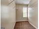 Walk-in closet featuring wire shelves and natural light from a window at 3953 Willow Fields Ct, Loganville, GA 30052