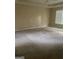 Spacious bedroom with carpet, ceiling fan, and lots of natural light at 4887 Winterview Ln, Douglasville, GA 30135