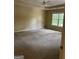 A bedroom with yellow walls and a ceiling fan at 4887 Winterview Ln, Douglasville, GA 30135