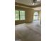 Spacious bedroom with carpet, ceiling fan, tray ceilings, and lots of natural light at 4887 Winterview Ln, Douglasville, GA 30135