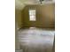 Carpeted bedroom featuring neutral walls, a ceiling fan, and a single window at 4887 Winterview Ln, Douglasville, GA 30135