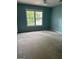 A bedroom with blue walls, a window, and a ceiling fan at 4887 Winterview Ln, Douglasville, GA 30135