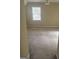 Carpeted bedroom featuring neutral walls and a single window at 4887 Winterview Ln, Douglasville, GA 30135