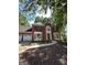 Charming two-story brick home with a well-manicured lawn, two car garage, and inviting front entrance at 4887 Winterview Ln, Douglasville, GA 30135