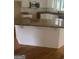 Bright kitchen featuring white cabinets, granite countertops, and an island, ideal for cooking and entertaining at 4887 Winterview Ln, Douglasville, GA 30135