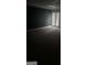 Spacious room with a dark accent wall and large window, creating a modern and serene atmosphere at 4887 Winterview Ln, Douglasville, GA 30135
