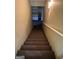 Carpeted stairs lead to a bright area, enhanced with a clean white railing at 4887 Winterview Ln, Douglasville, GA 30135