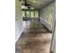 Bright sunroom featuring stone floors, lots of windows and ceiling fans at 4887 Winterview Ln, Douglasville, GA 30135